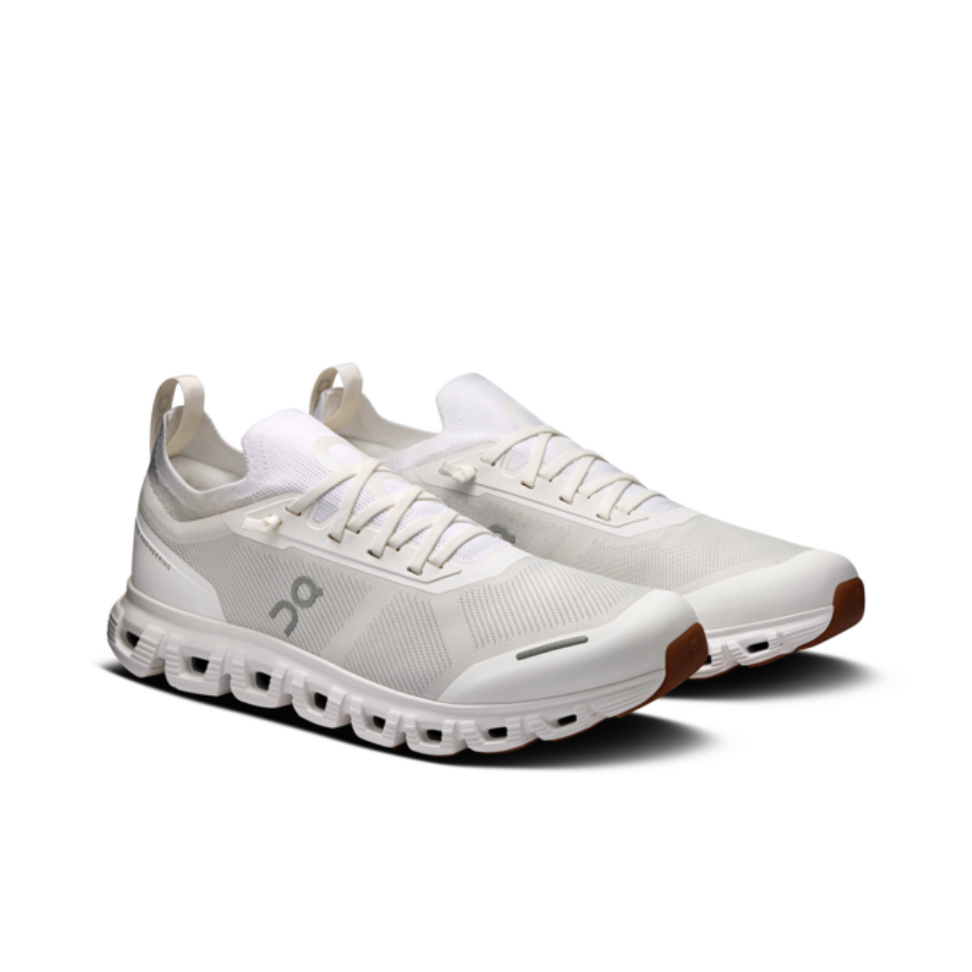 White running shoes with a unique sole design on a white background